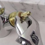 Where is the axle valve located in the mixer?